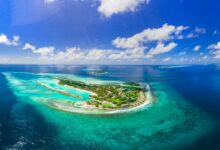 Aerial view of pristine tropical island surrounded by turquoise waters