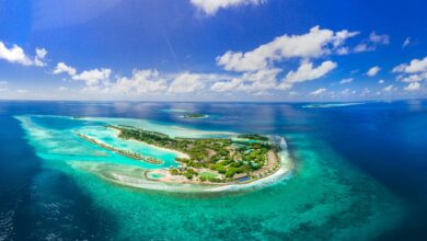 Aerial view of pristine tropical island surrounded by turquoise waters