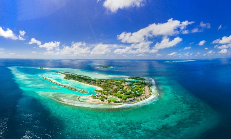 Aerial view of pristine tropical island surrounded by turquoise waters