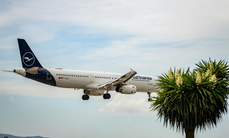 Commercial airplane landing at airport representing international travel for trade missions