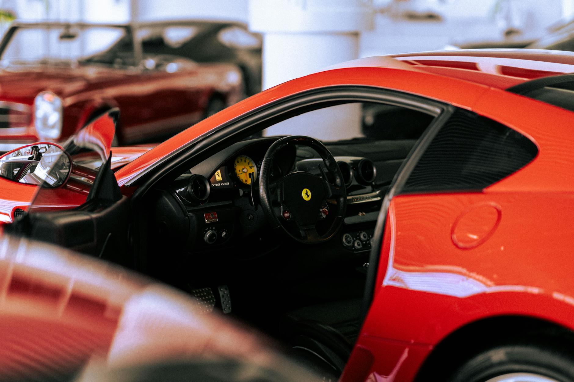 Row of luxury vehicles at an upscale automotive facility