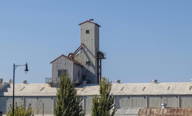 Industrial building complex representing former manufacturing facilities now housing government contractors