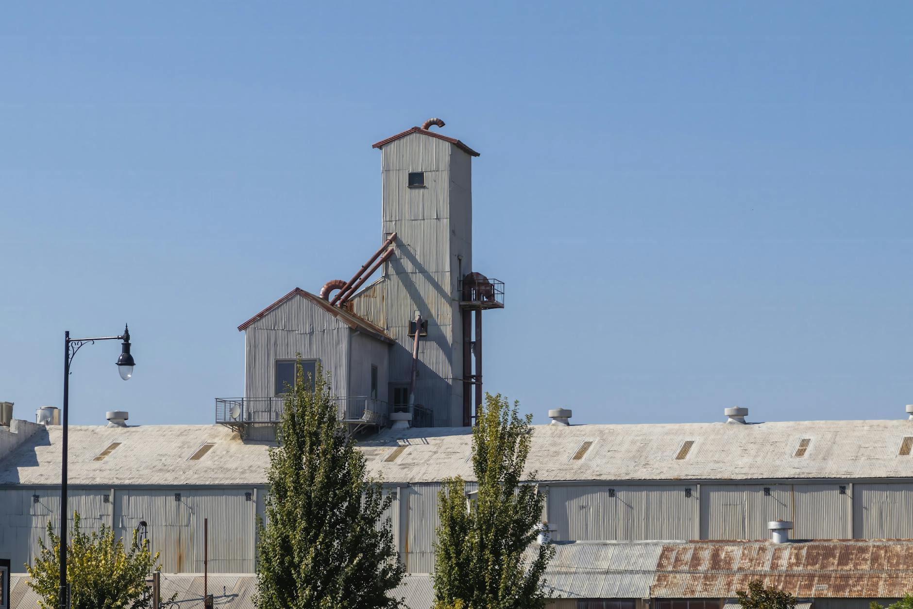 Industrial building complex representing former manufacturing facilities now housing government contractors