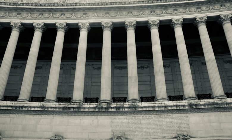Classical government building with columns representing state financial authority and regulatory oversight