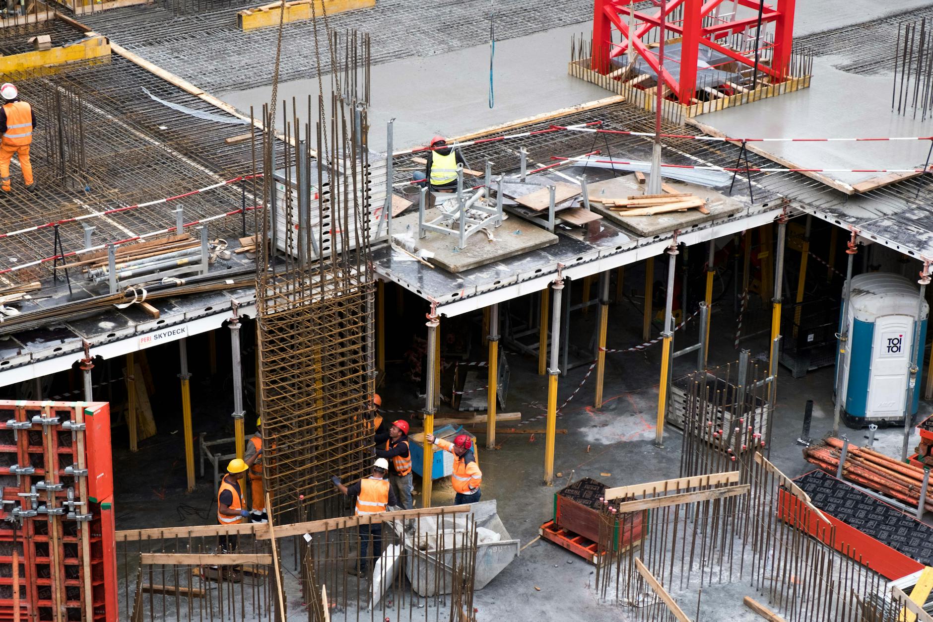 Construction workers and equipment at an infrastructure development site