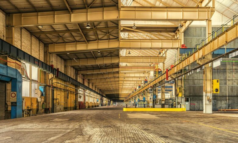 Large industrial warehouse interior with stacked materials and storage systems