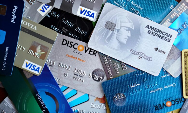Credit cards and shopping bags representing traditional payment methods