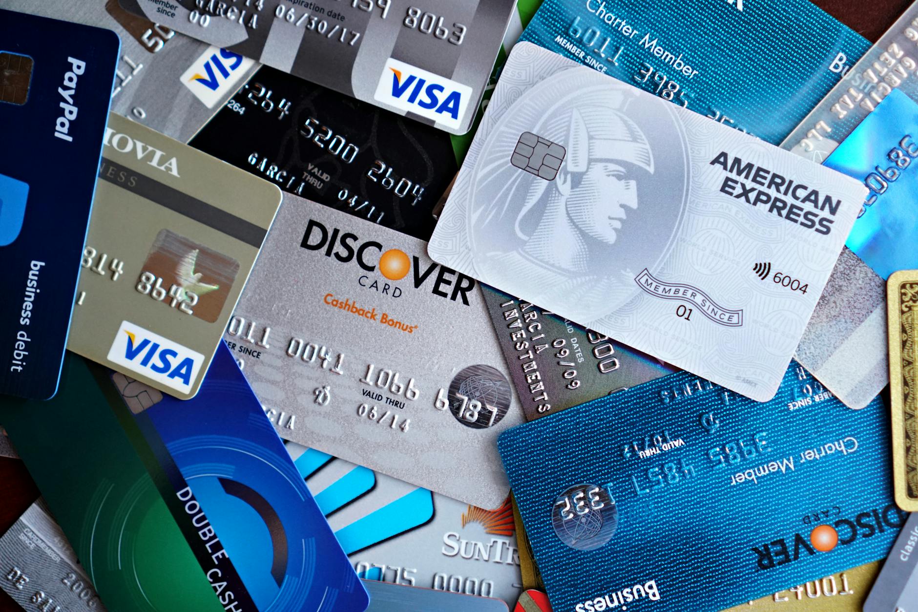 Credit cards and shopping bags representing traditional payment methods
