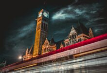 Municipal officials meeting in city hall chamber discussing policy coordination