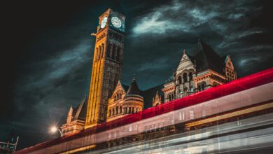 Municipal officials meeting in city hall chamber discussing policy coordination