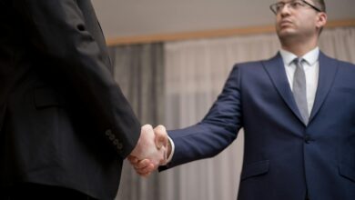 Professional business meeting with handshake representing wealth planning discussions