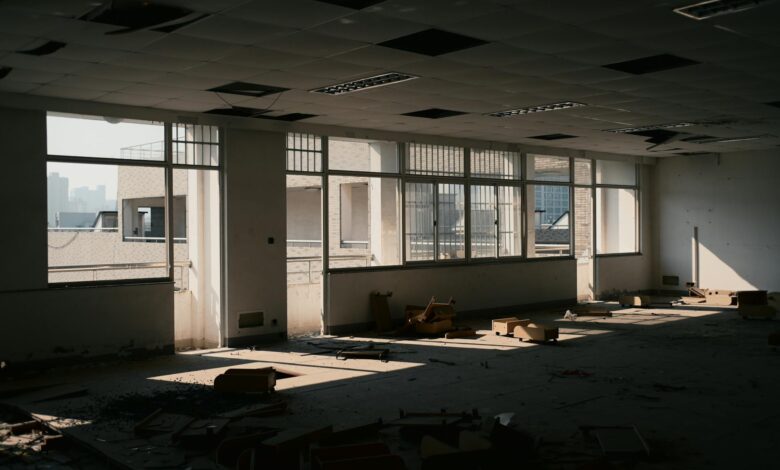 Modern office building with vacant floors and minimal lighting