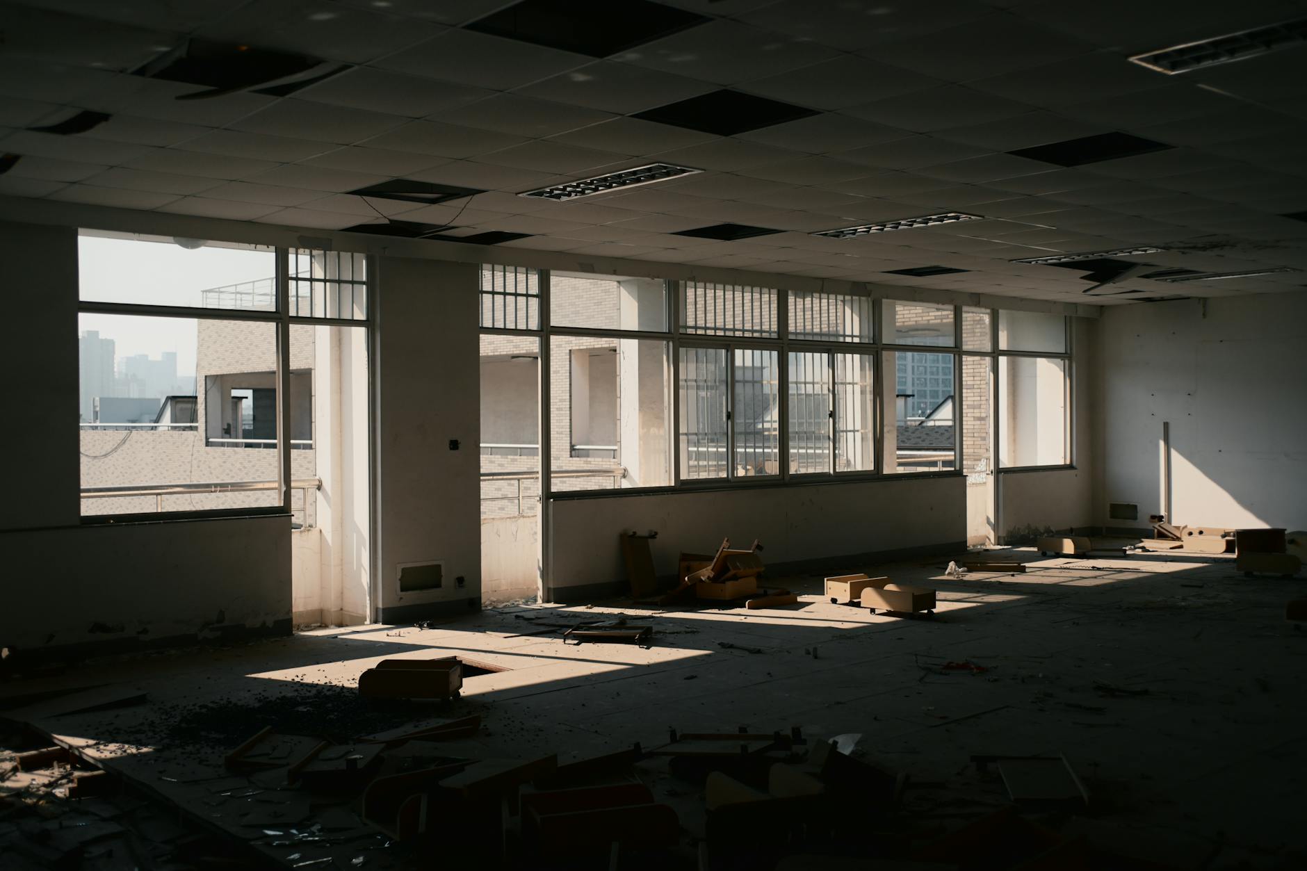 Modern office building with vacant floors and minimal lighting