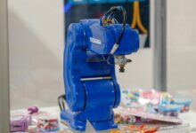 Automated warehouse facility with robotic systems handling inventory and packages