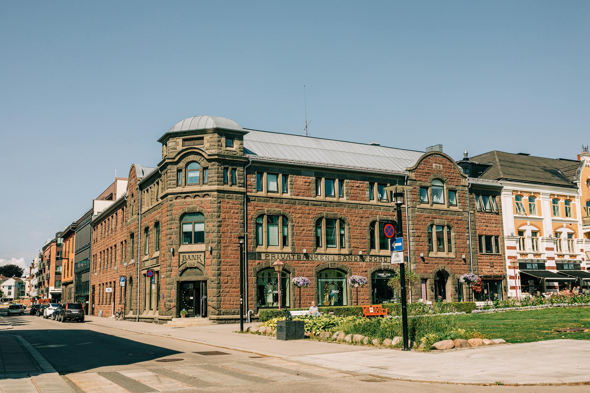Empty small town bank building with closed sign, representing rural banking branch closures