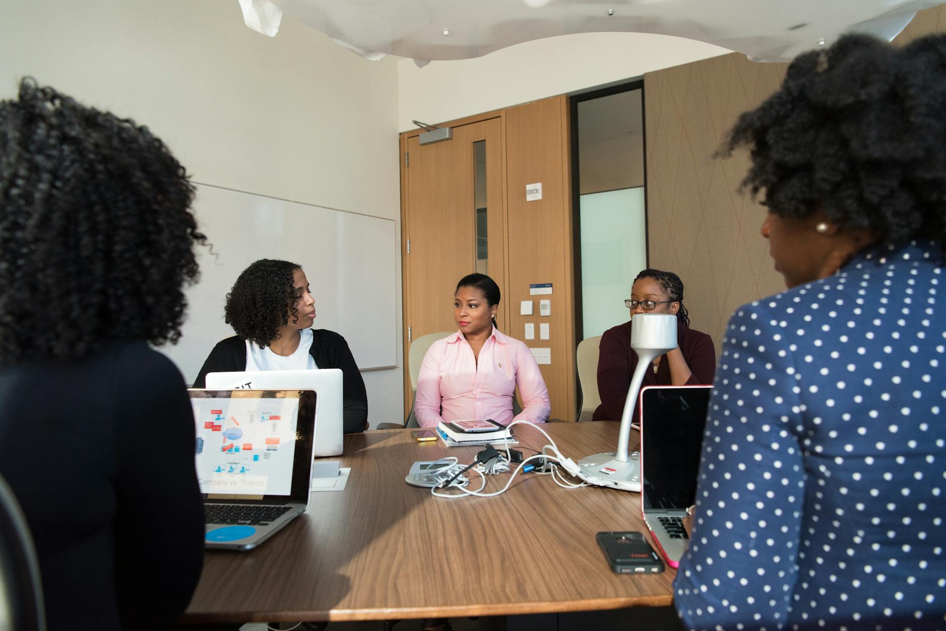 Business professionals meeting in modern office conference room