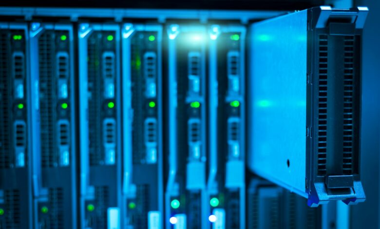 Modern data center server room with rows of equipment and LED lighting