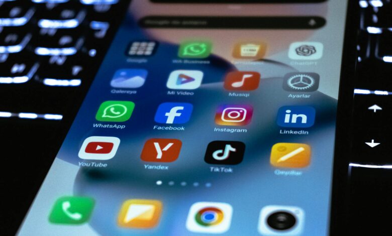 Person using smartphone with social media apps, representing digital organizing tools used by gig workers