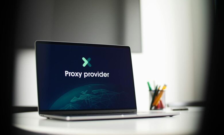 Person using laptop with privacy screen displaying data protection interface