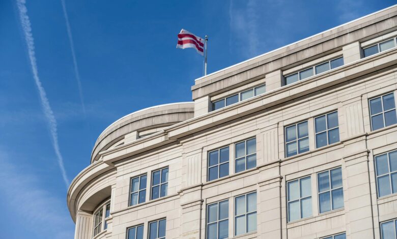 Modern government office building exterior with American flag