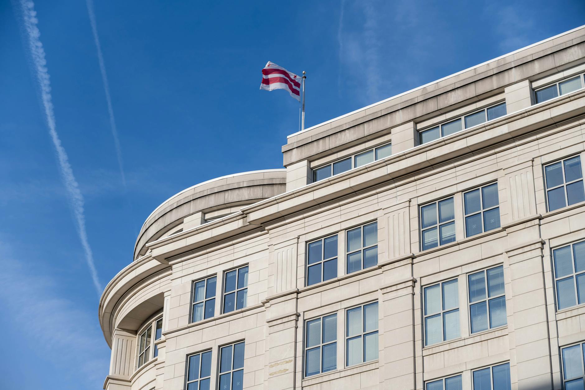 Modern government office building exterior with American flag