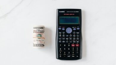 Calculator and financial documents showing CD interest rate calculations