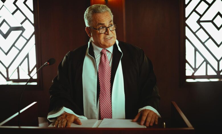 Government official speaking at podium with American flags