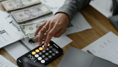 Financial calculator and planning documents on desk representing retirement calculations