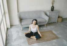 Modern office meditation and wellness space with comfortable seating and natural lighting