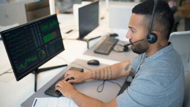 Modern trading floor with multiple computer screens displaying market data