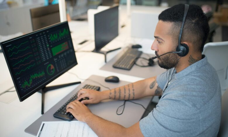 Modern trading floor with multiple computer screens displaying market data