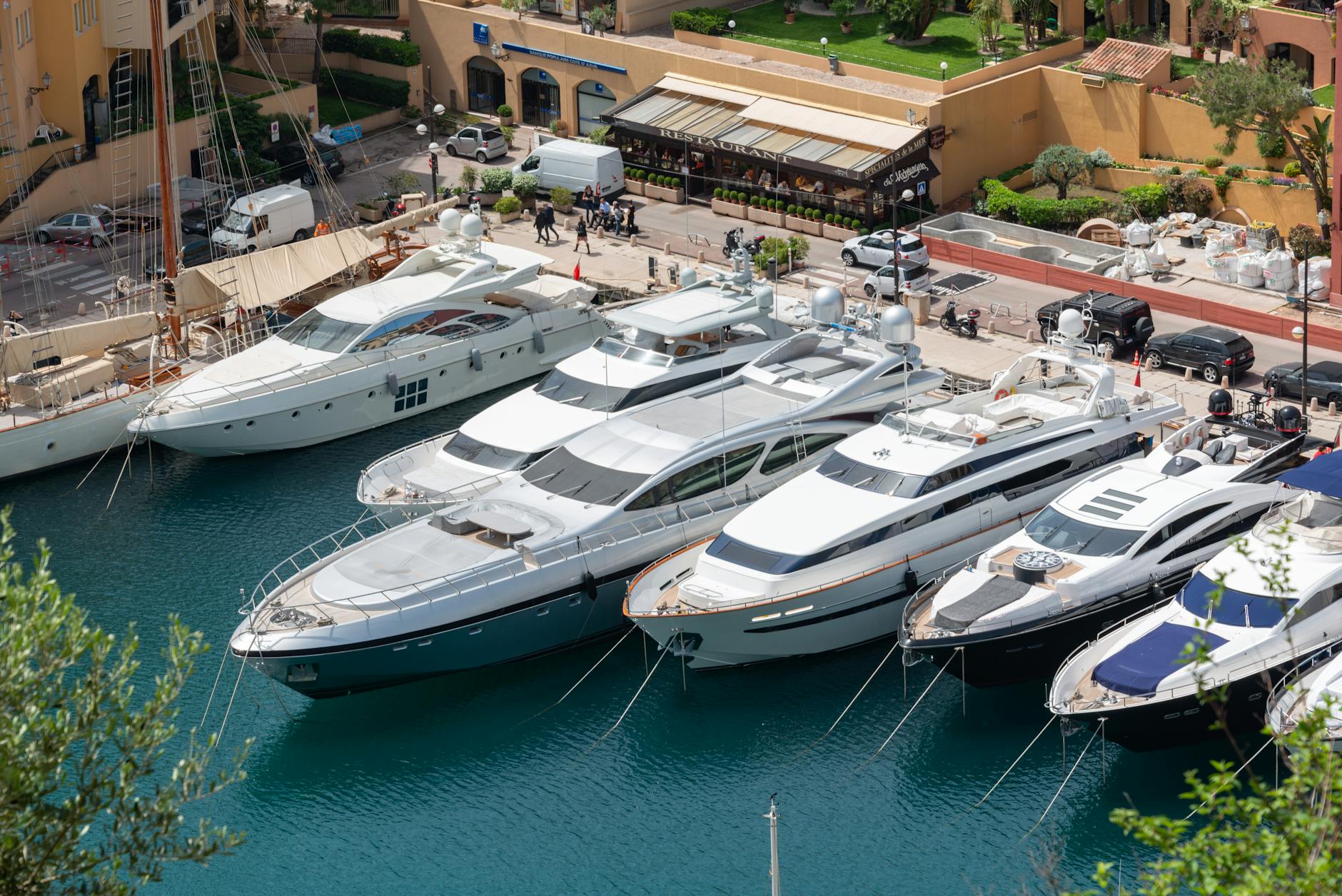 Luxury yacht moored at private marina with tropical backdrop