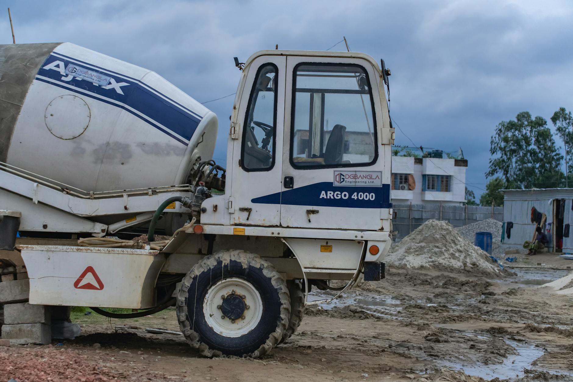 Concrete mixer truck delivering materials to construction project
