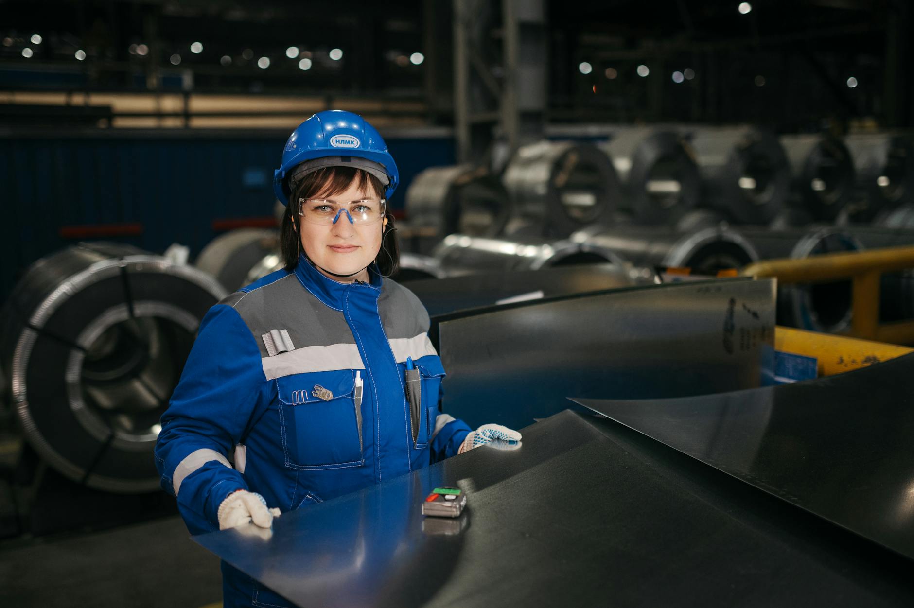 Steel manufacturing facility with raw materials and industrial equipment