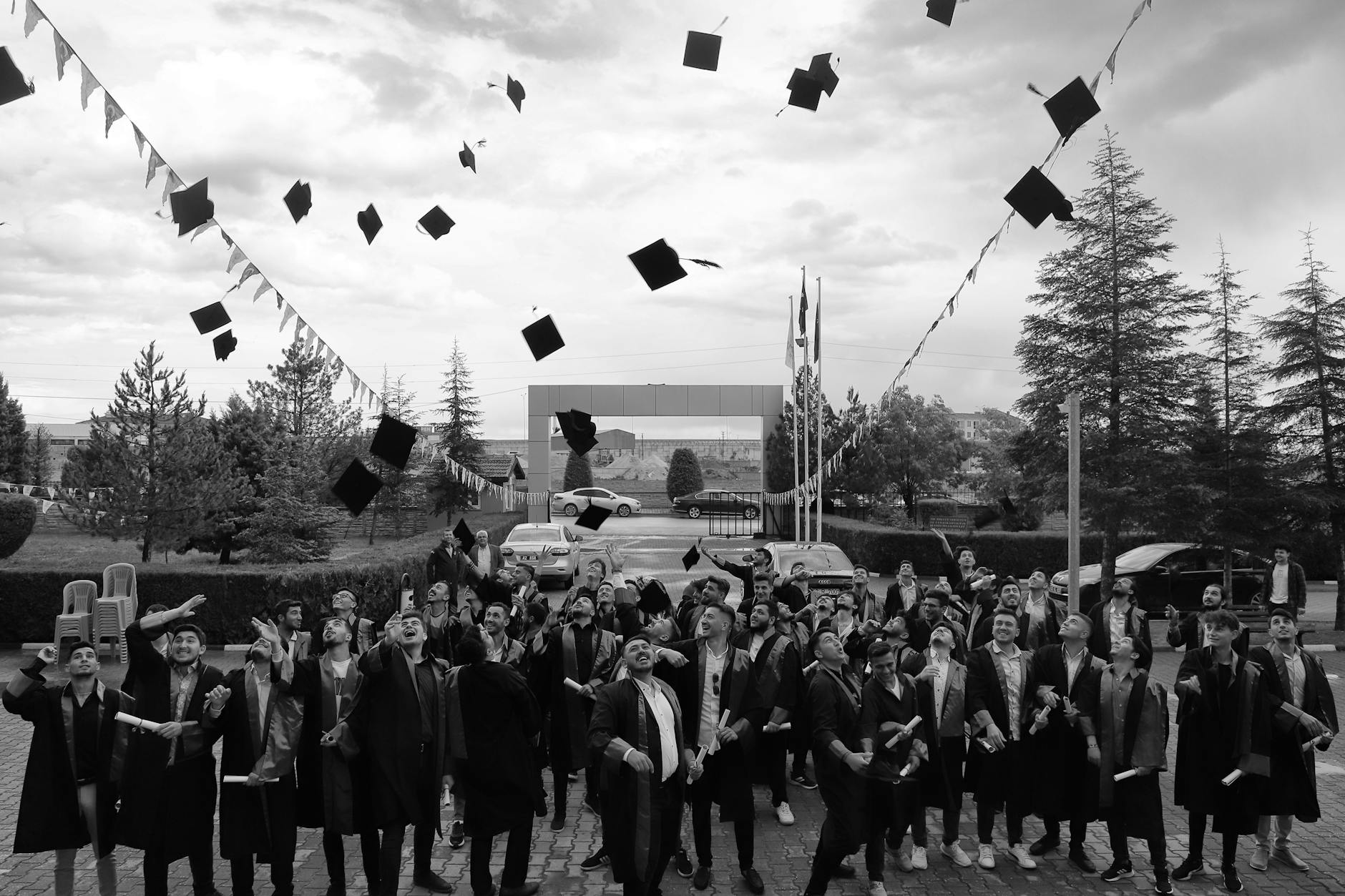 Graduate students in caps and gowns at university commencement ceremony
