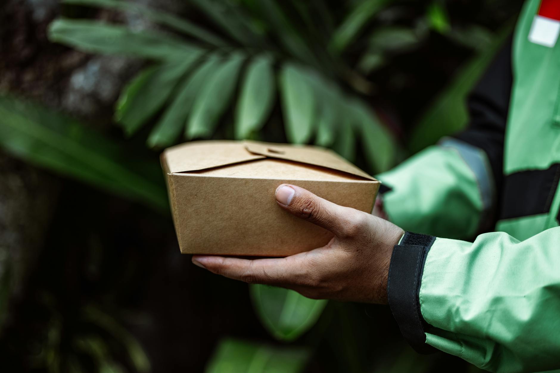 Restaurant worker packaging food orders for delivery service