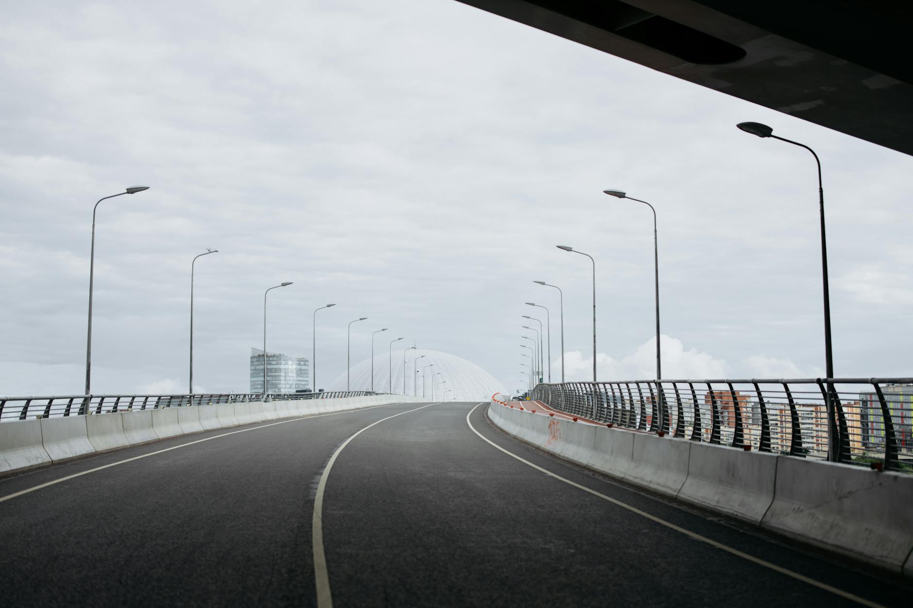 Modern highway infrastructure with multiple lanes and overhead signs