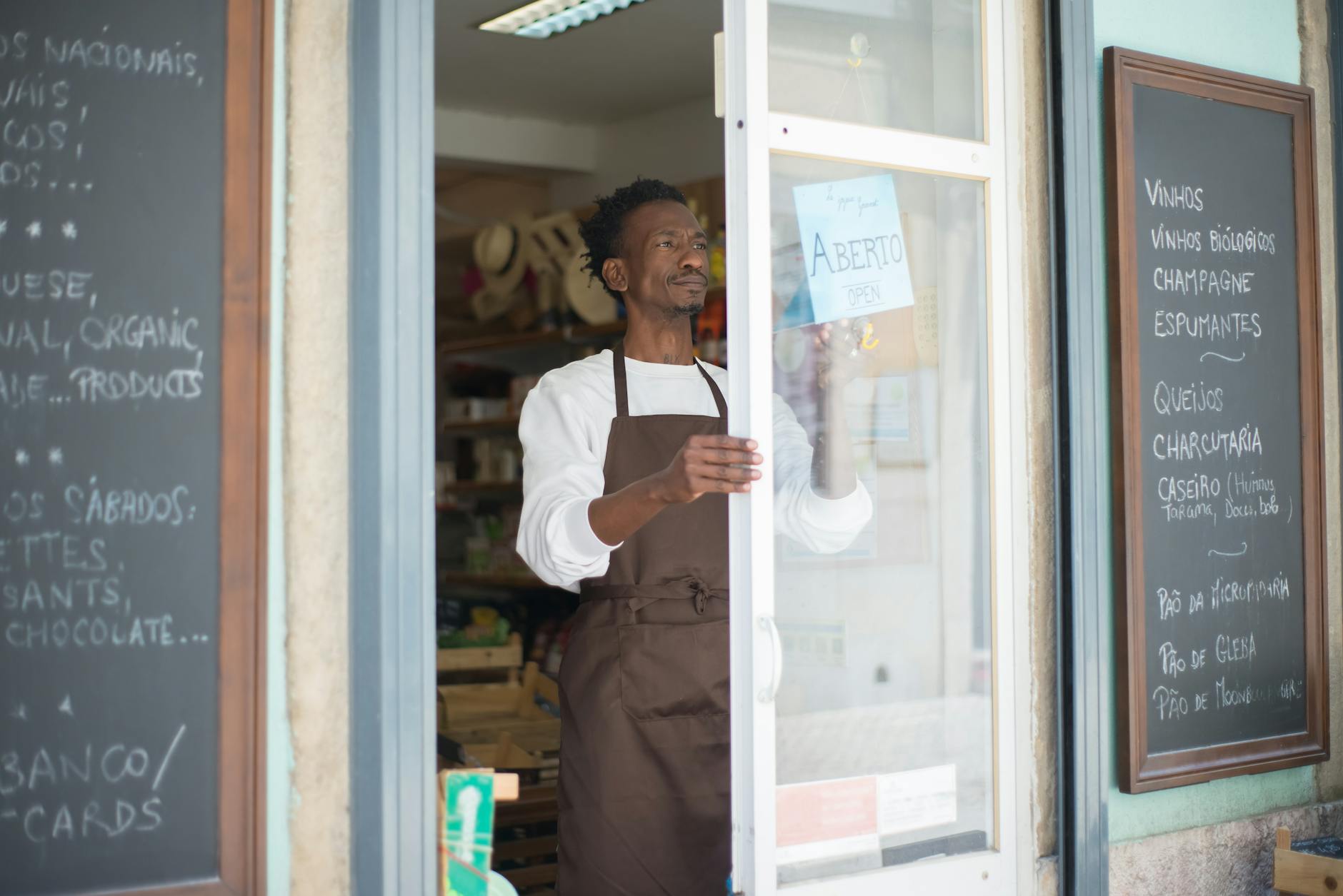 Rural business owner reviewing financial documents at desk, representing challenges accessing business credit