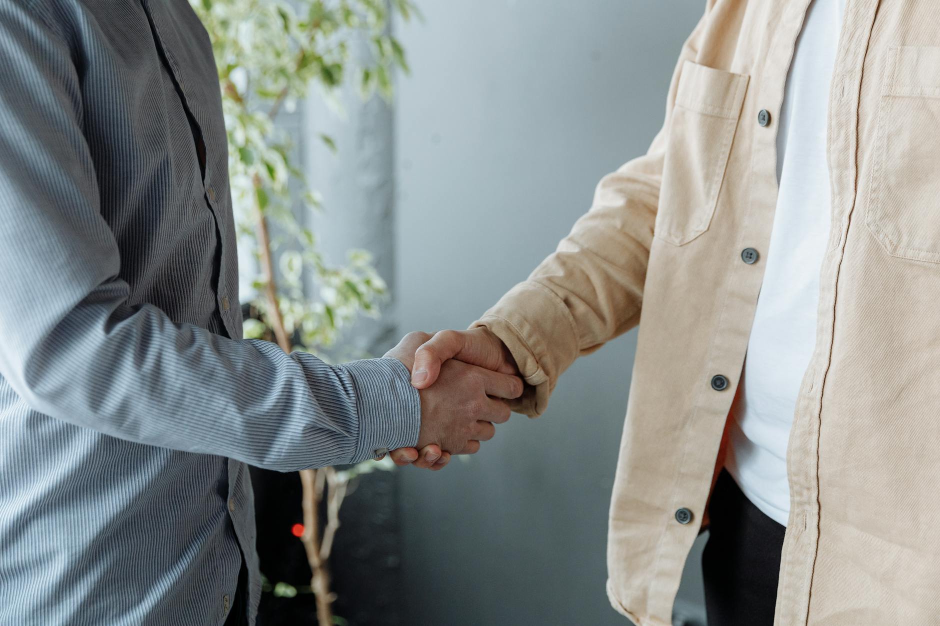 Professional handshake between banker and customer during consultation