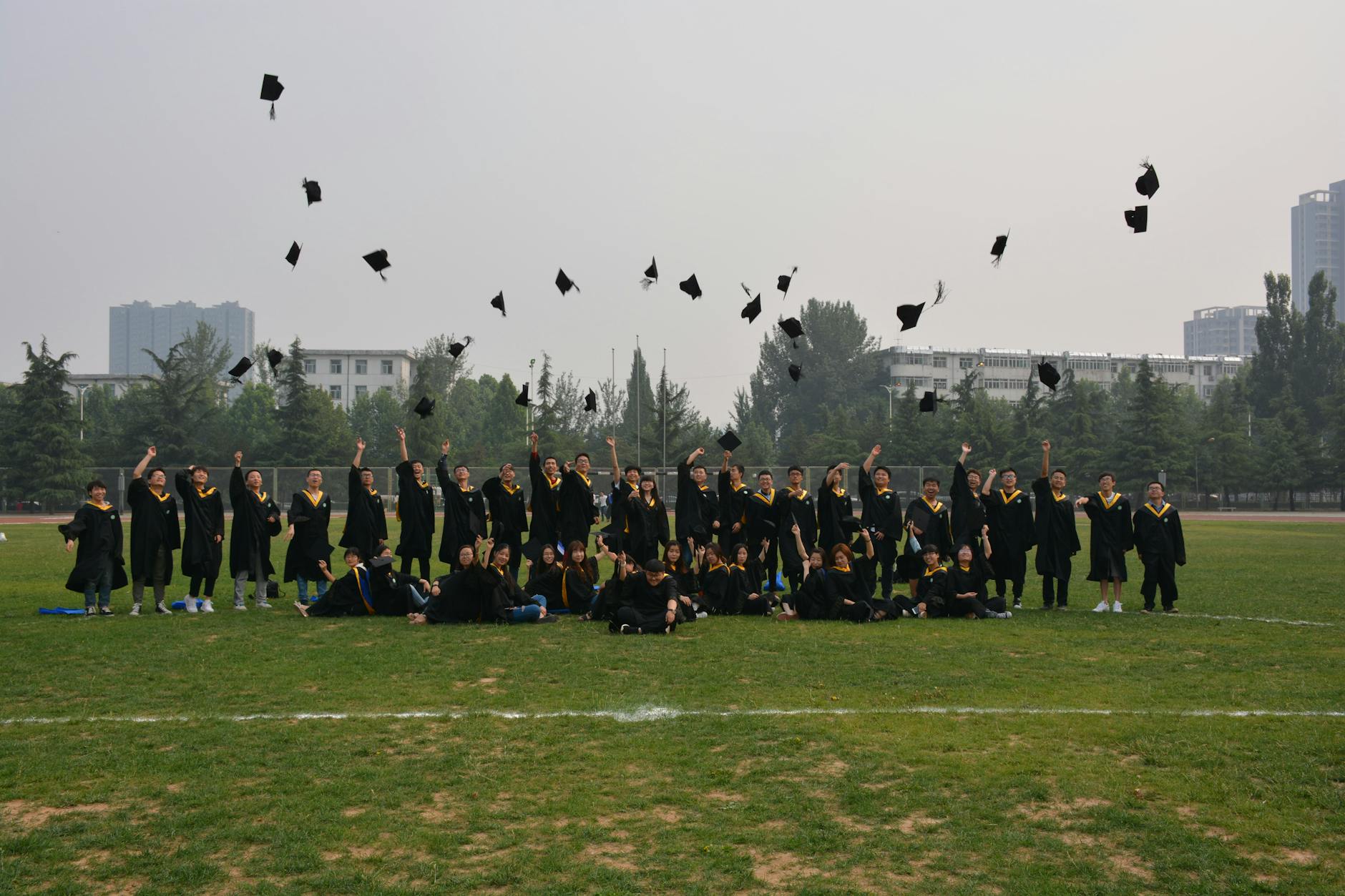 University graduation ceremony with graduates in caps and gowns celebrating degree completion