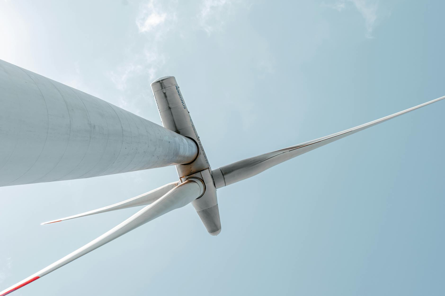 Wind turbines generating renewable energy against blue sky