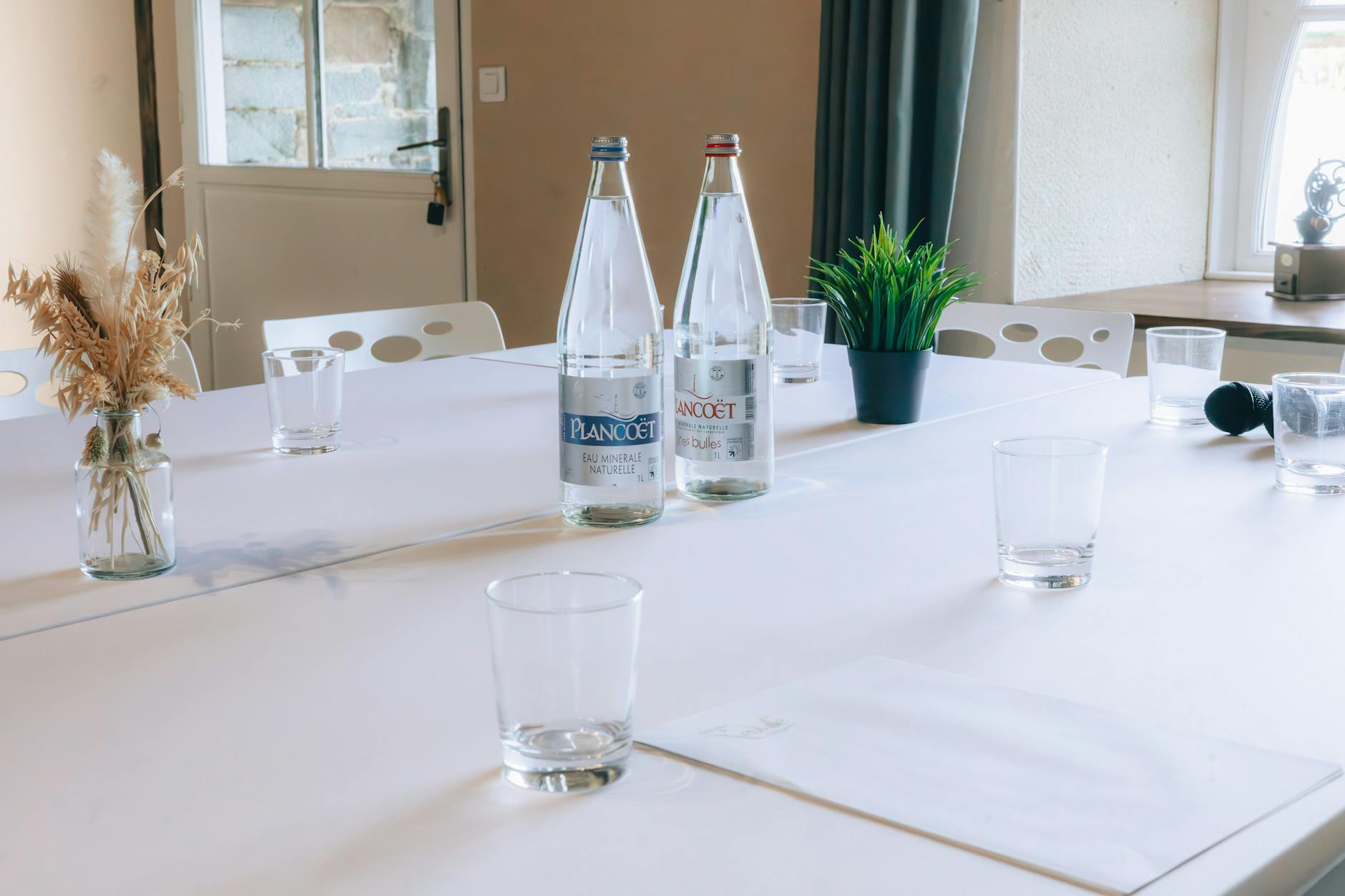 Conference room with officials discussing policy at long table