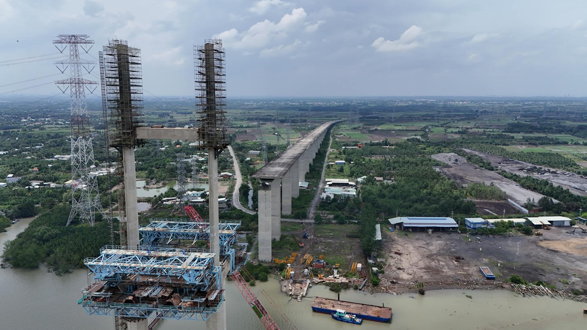 Highway bridge under construction showing steel and concrete infrastructure work