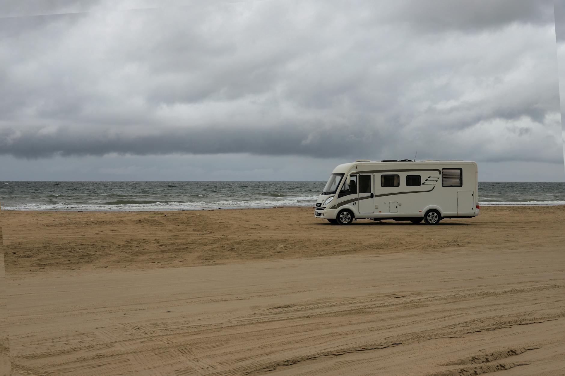 Recreational vehicles parked at campground during golden hour