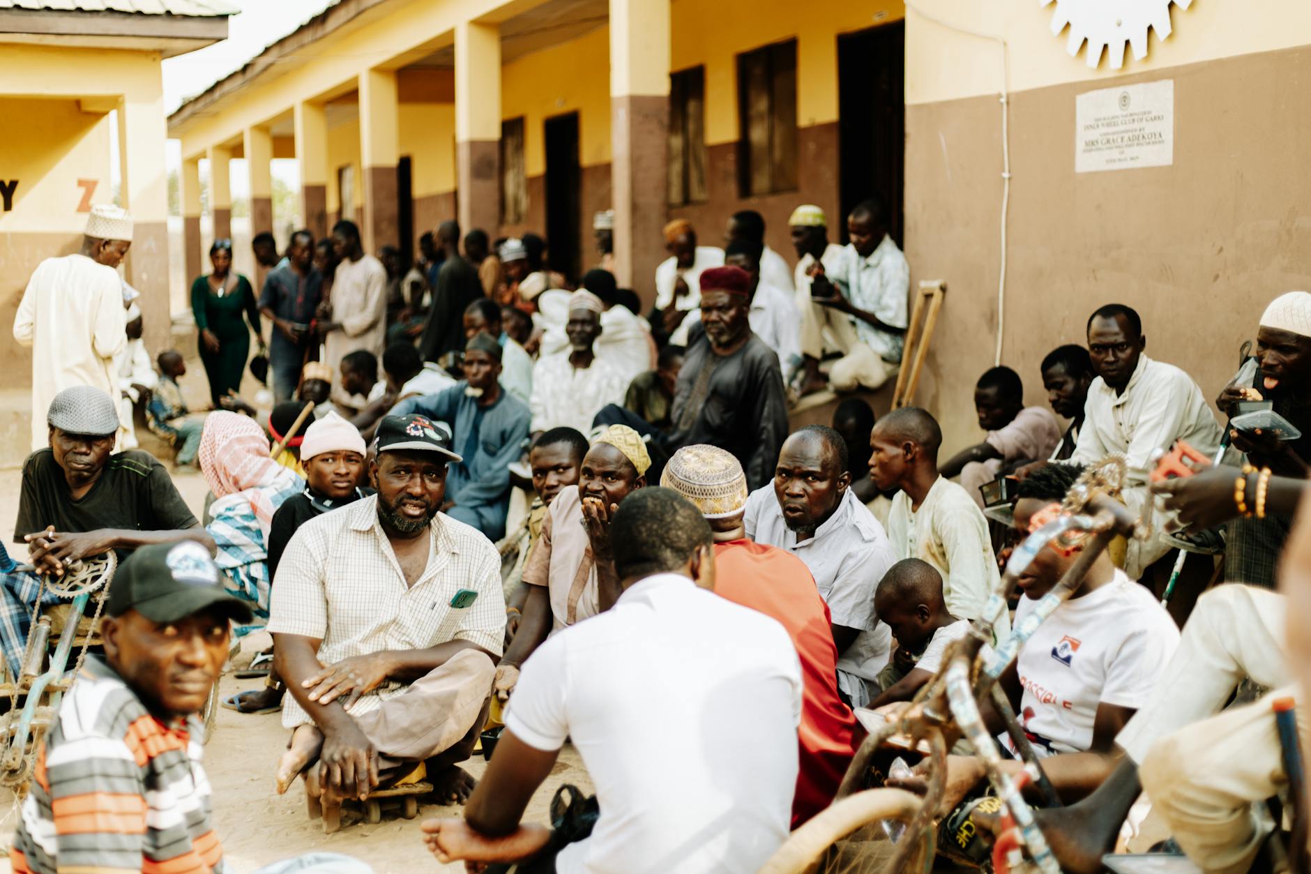 Diverse group of people gathered at community meeting representing immigrant support services