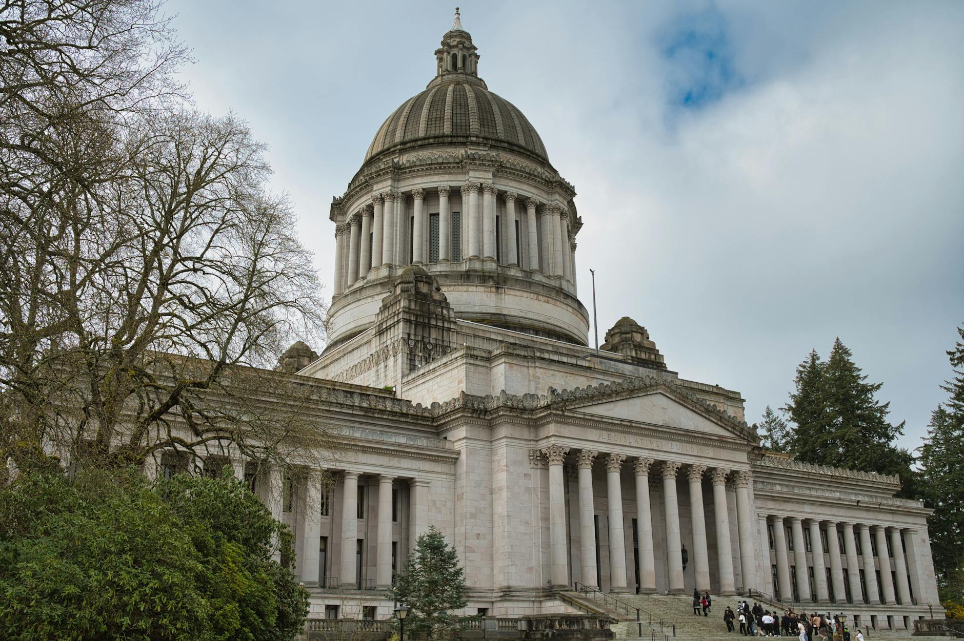 State capitol building dome with American flag flying