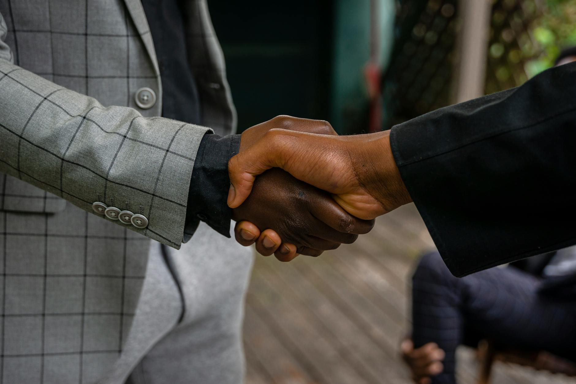 Professional handshake between business partners sealing a financial agreement