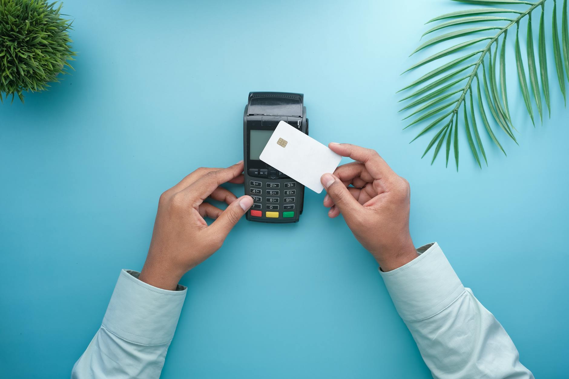 Person using credit card at payment terminal in retail store