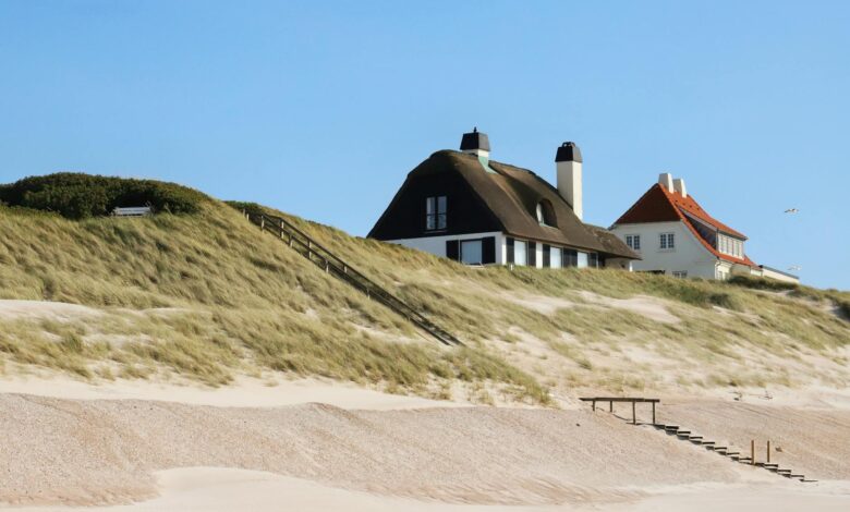Oceanfront residential property with waves approaching the shoreline