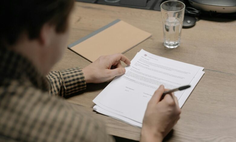 Legal documents and pen on a desk representing estate planning and trust formation